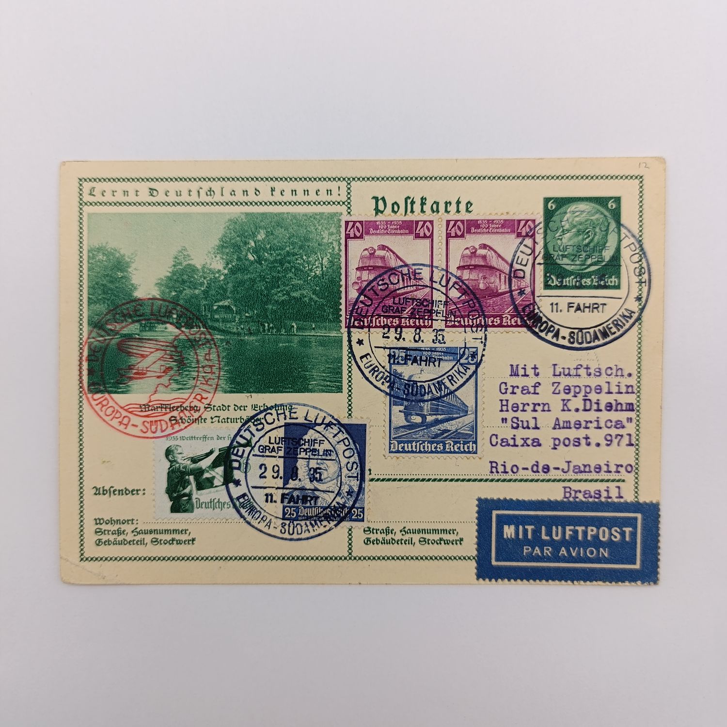 German Airport postcard flown on the GrafZeppelin on the Europa - Sudamerika line to R10 De Jameiro, Brazil - Posted 29/8/1935 - Pre printed postage uprated with 5 attractive stamps