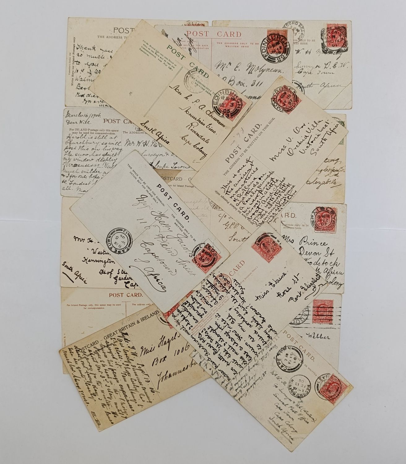 Lot of 25 postcards posted pre 1910 Britain to South Africa - over a century ago - all with stamps