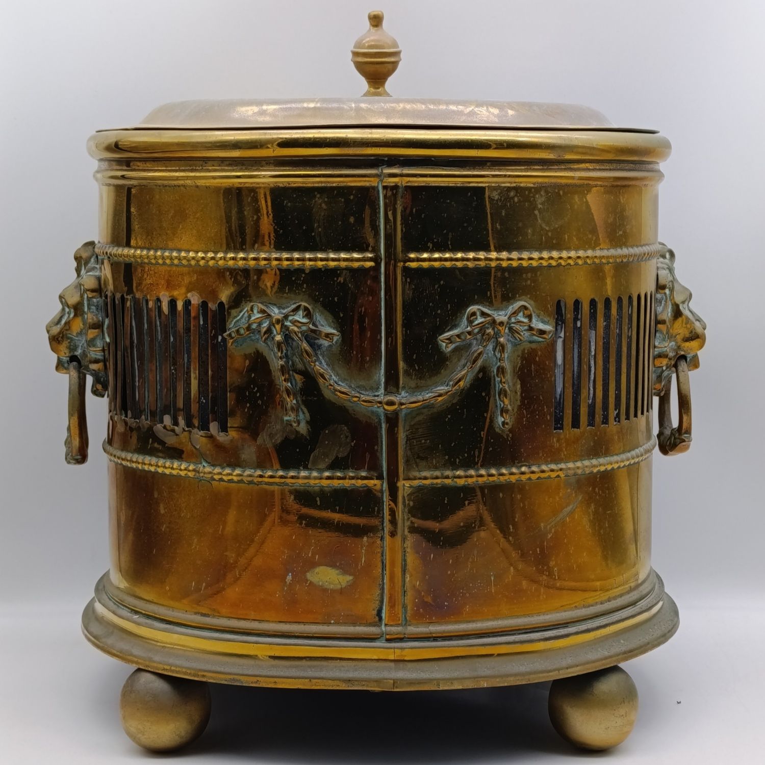 Antique brass coal bucket with lion head handles