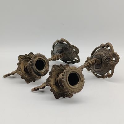 Pair of antique brass wall mounted candle holders