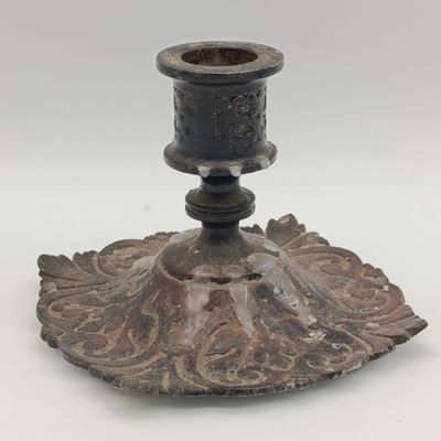 Pair of antique cast iron candle holders