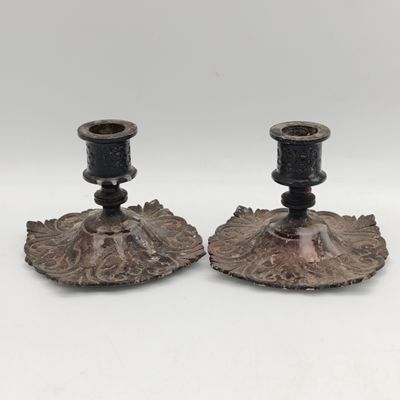 Pair of antique cast iron candle holders