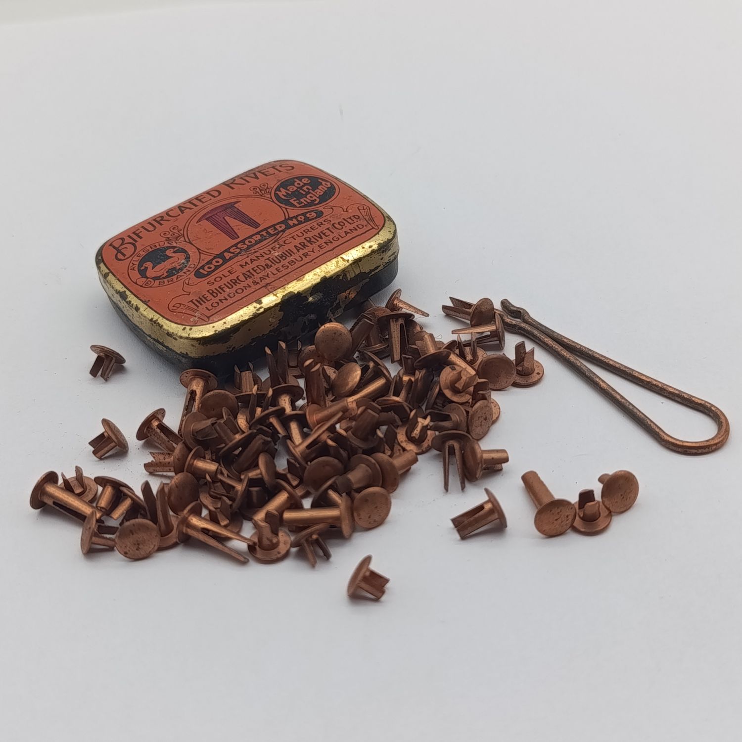 Antique bifurcated Rivets in tin