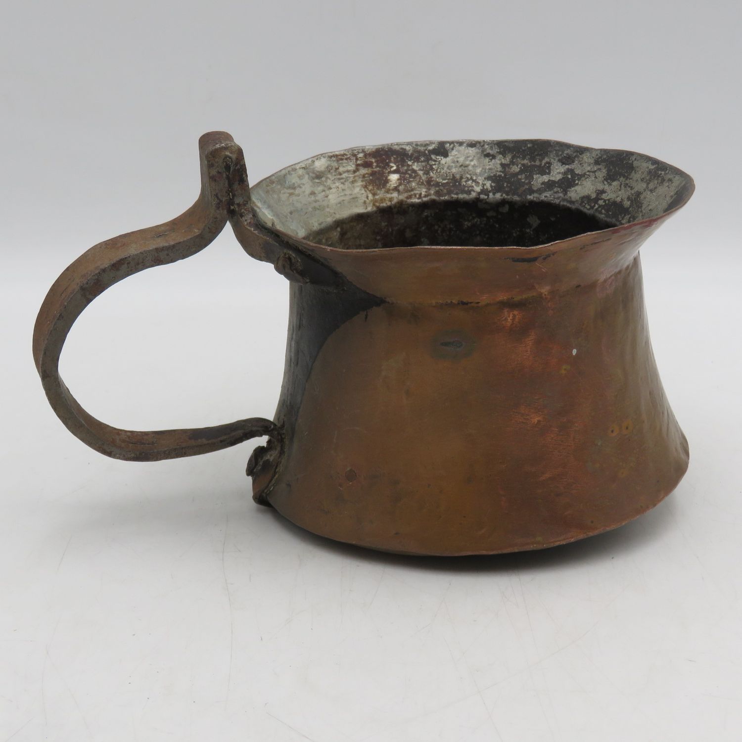 Antique hammered copper coffee pot with iron handle