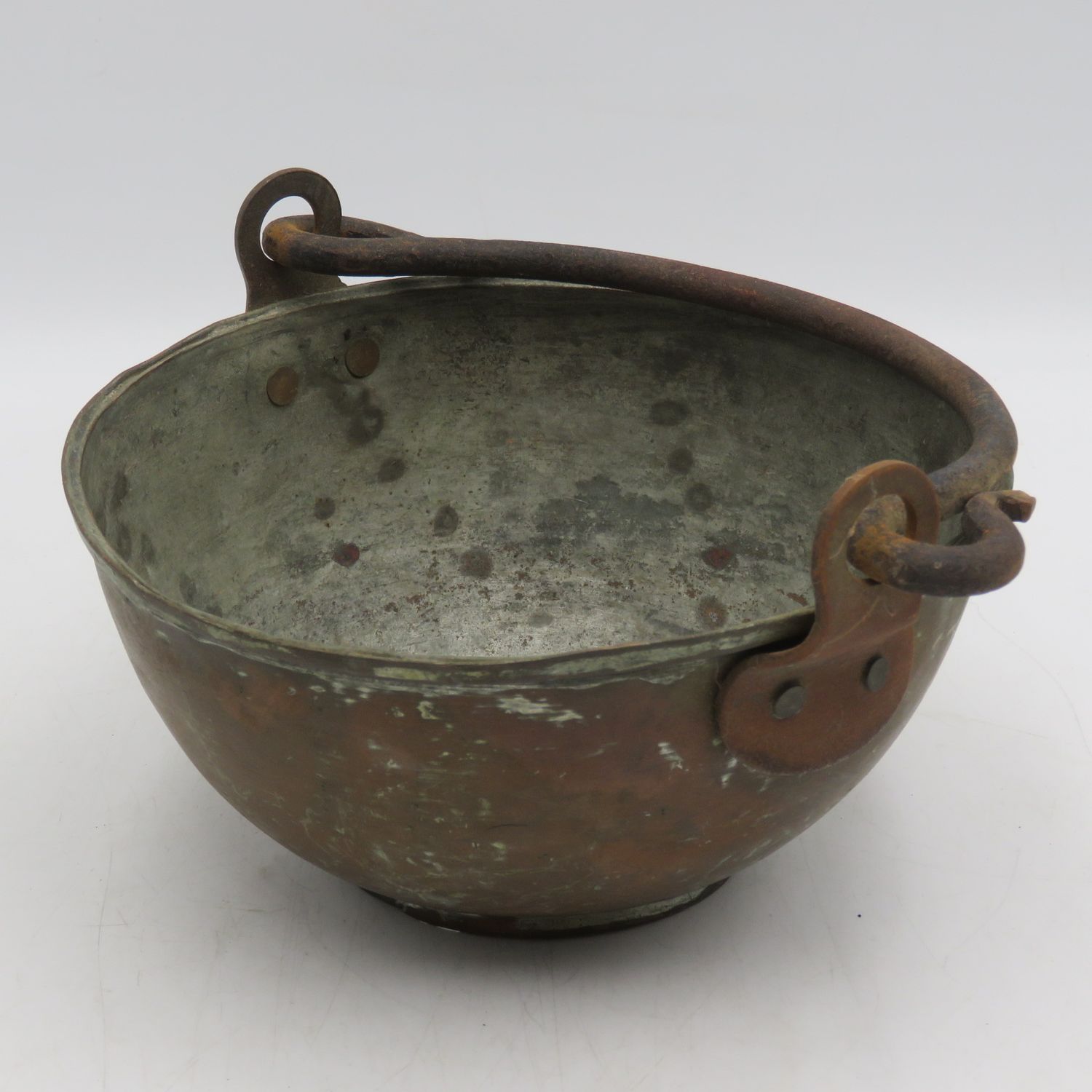 Antique copper bowl with cast iron handle