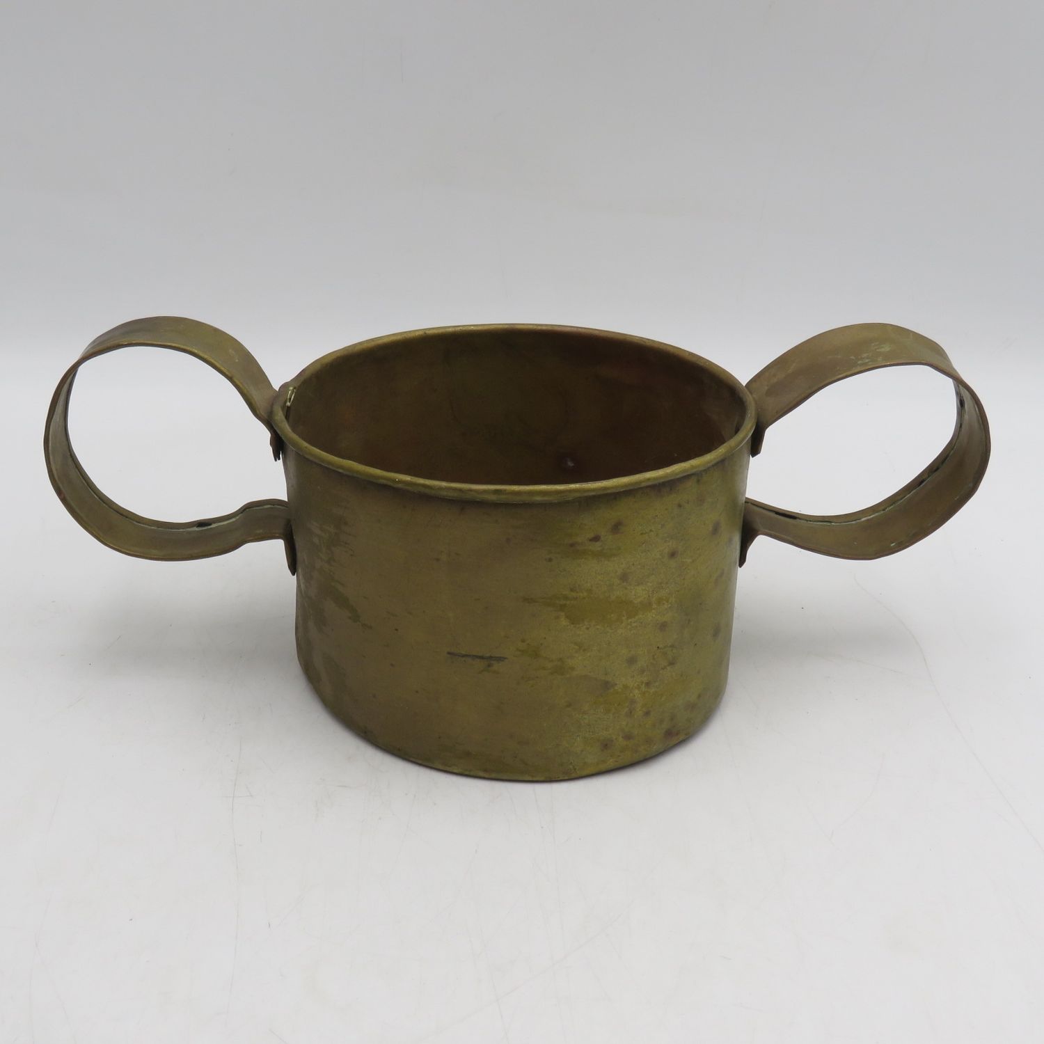 Antique brass cup with large handles