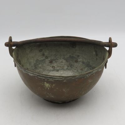 Antique copper bowl with cast iron handle
