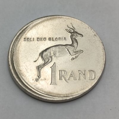 South Africa 1978 R1 coin. Misstruck with proof fields no proofs exist but are catalogued. This is possibly one of the very first struck.