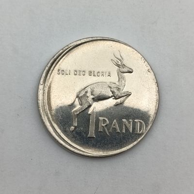 South Africa 1978 R1 coin. Misstruck with proof fields no proofs exist but are catalogued. This is possibly one of the very first struck.
