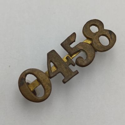 British regimental number 0458 shoulder title