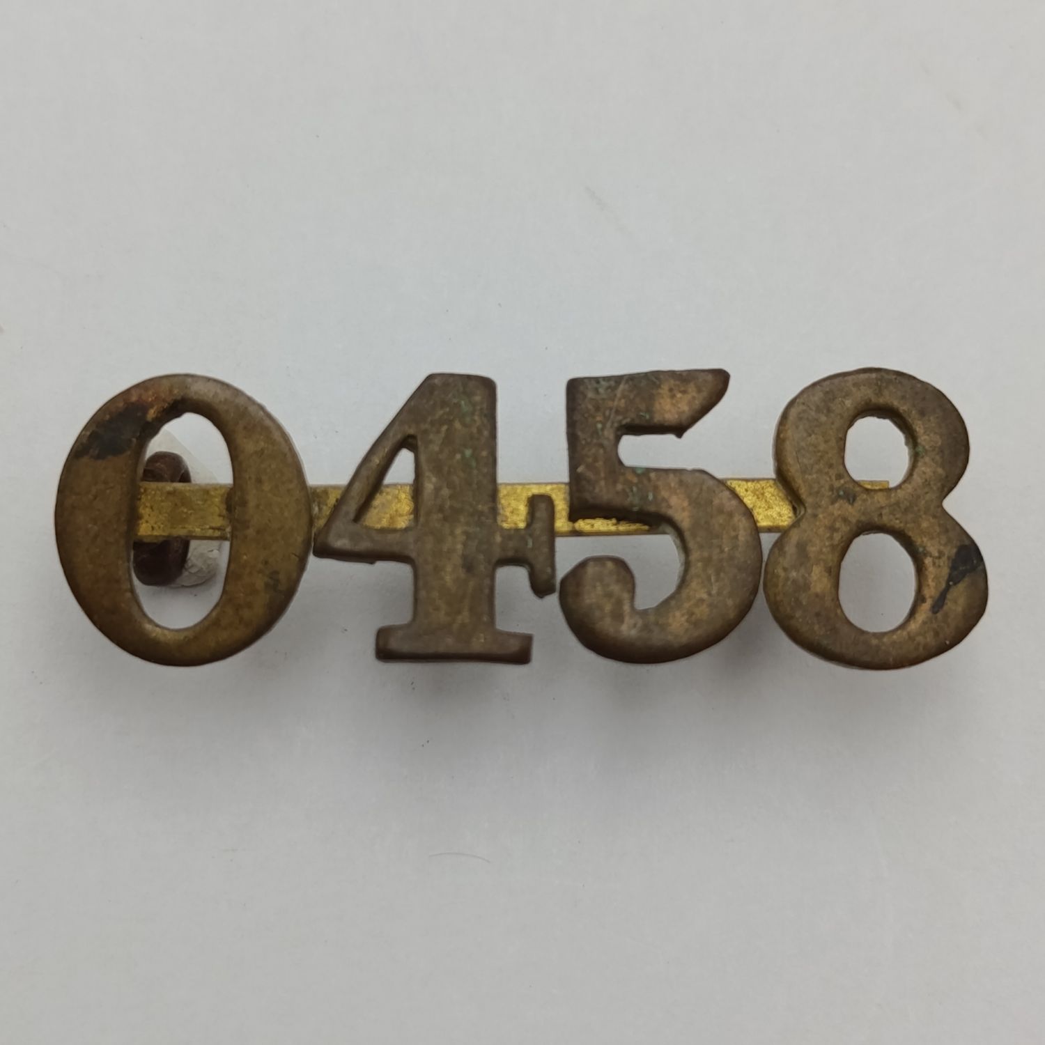 British regimental number 0458 shoulder title