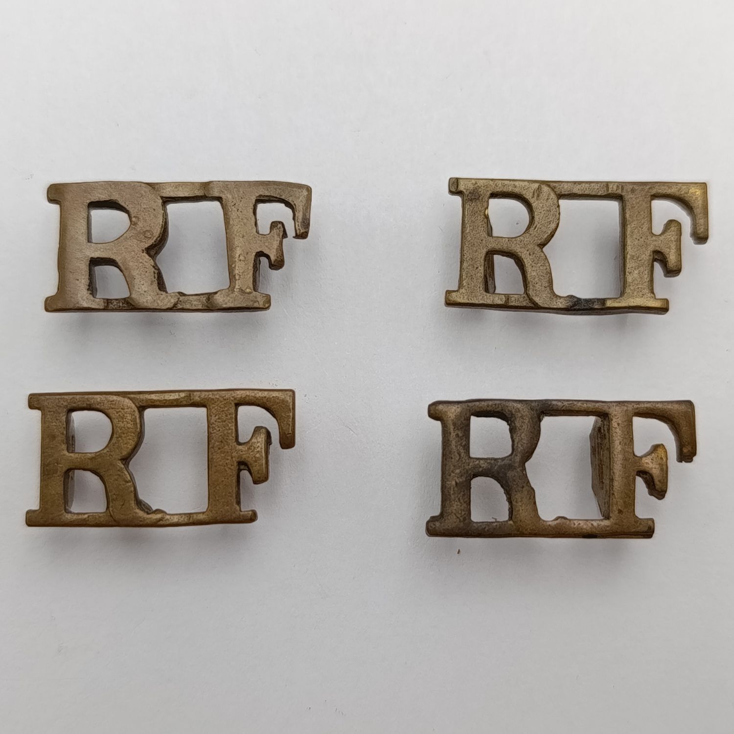 Lot of 4 British Royal Fusiliers shoulder titles