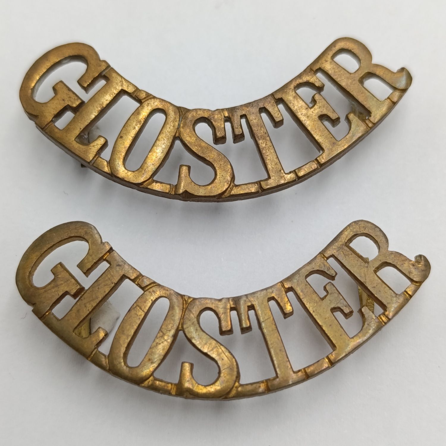 Pair of Gloucestershire regiment shoulder titles