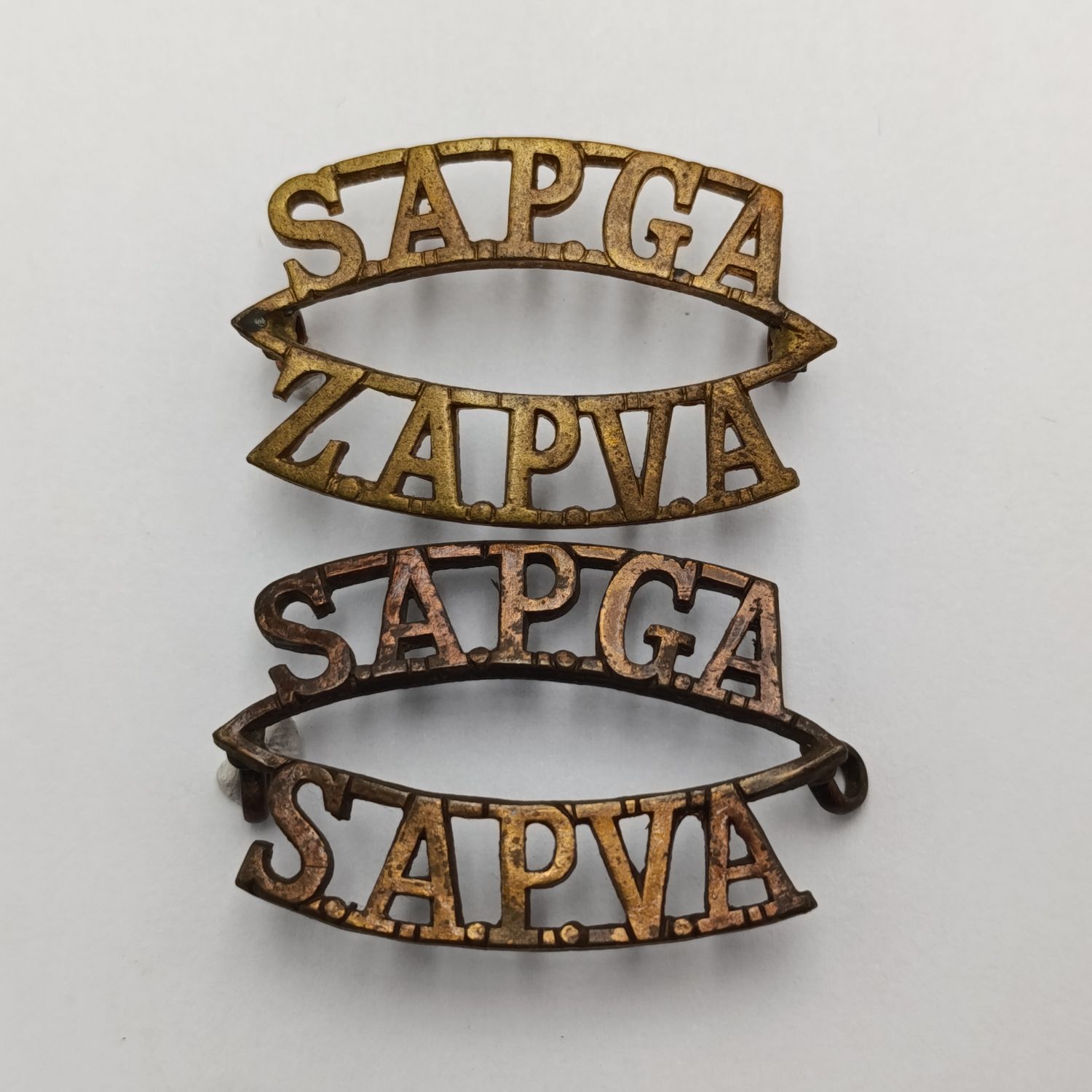 Pair of South African Permanent Garrison Artillery shoulder titles