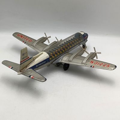Vintage United Airlines DC-7 Mainliner friction toy airplane - wheel repaired
