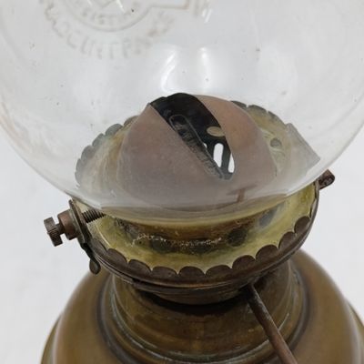 Vintage brass oil lamp with glass shade