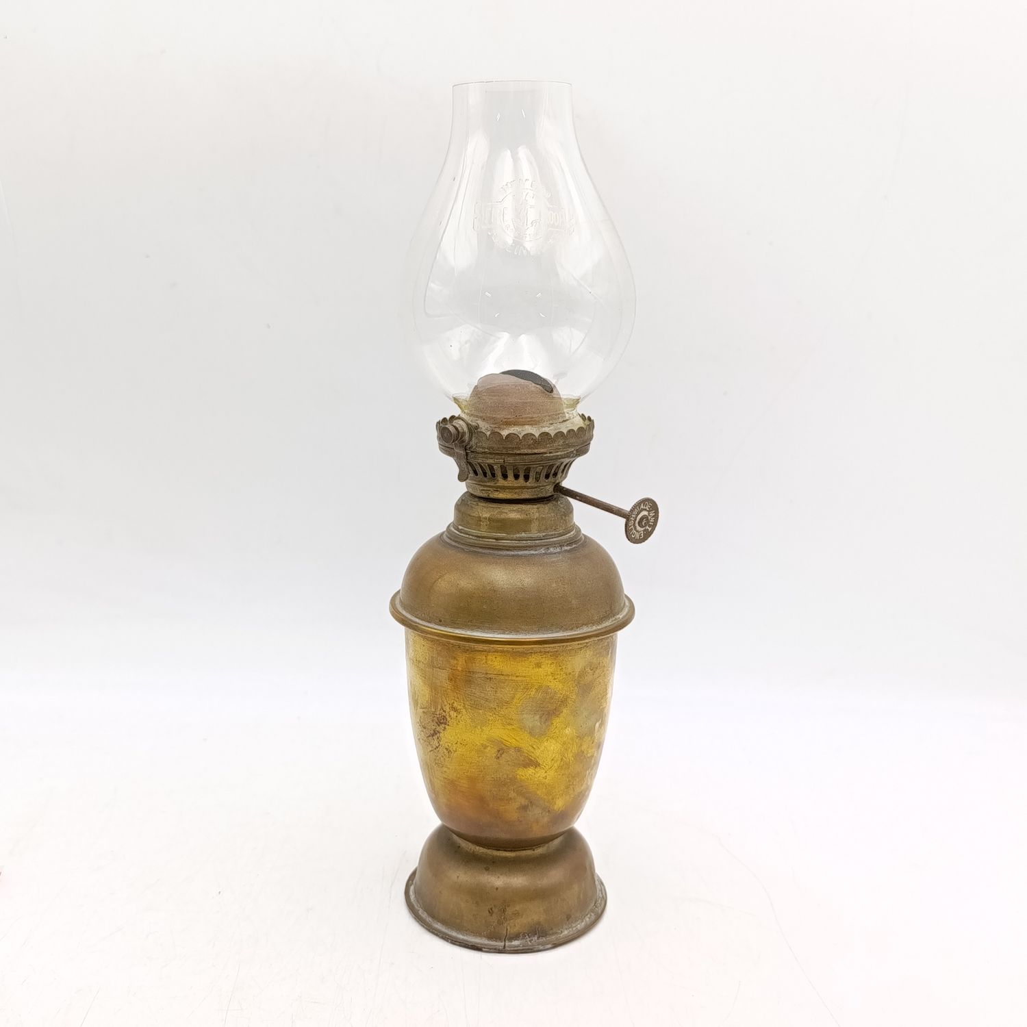Vintage brass oil lamp with glass shade