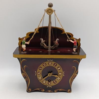 Vintage German novelty rocking swing clock - runs and stops