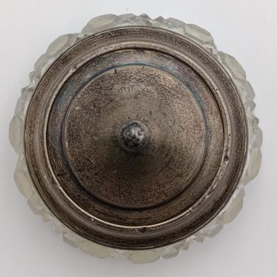 Cut glass vessel with sterling silver rim and lid