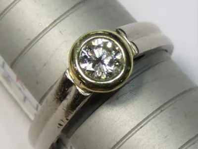 9kt White gold diamond ring with 18ct yellow gold tube setting for diamond - 0.41ct diamond