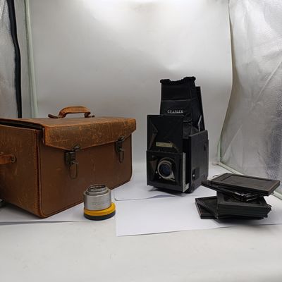 Vintage Graflex Super D medium format camera with 25 film plate holders and lens accessories