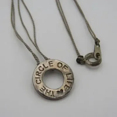 Sterling silver `Circle of Life` pendant with silk string necklace Length 40 cm