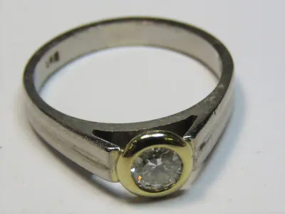 9kt White gold diamond ring with 18kt yellow gold tube setting for diamond - 0.41ct diamond