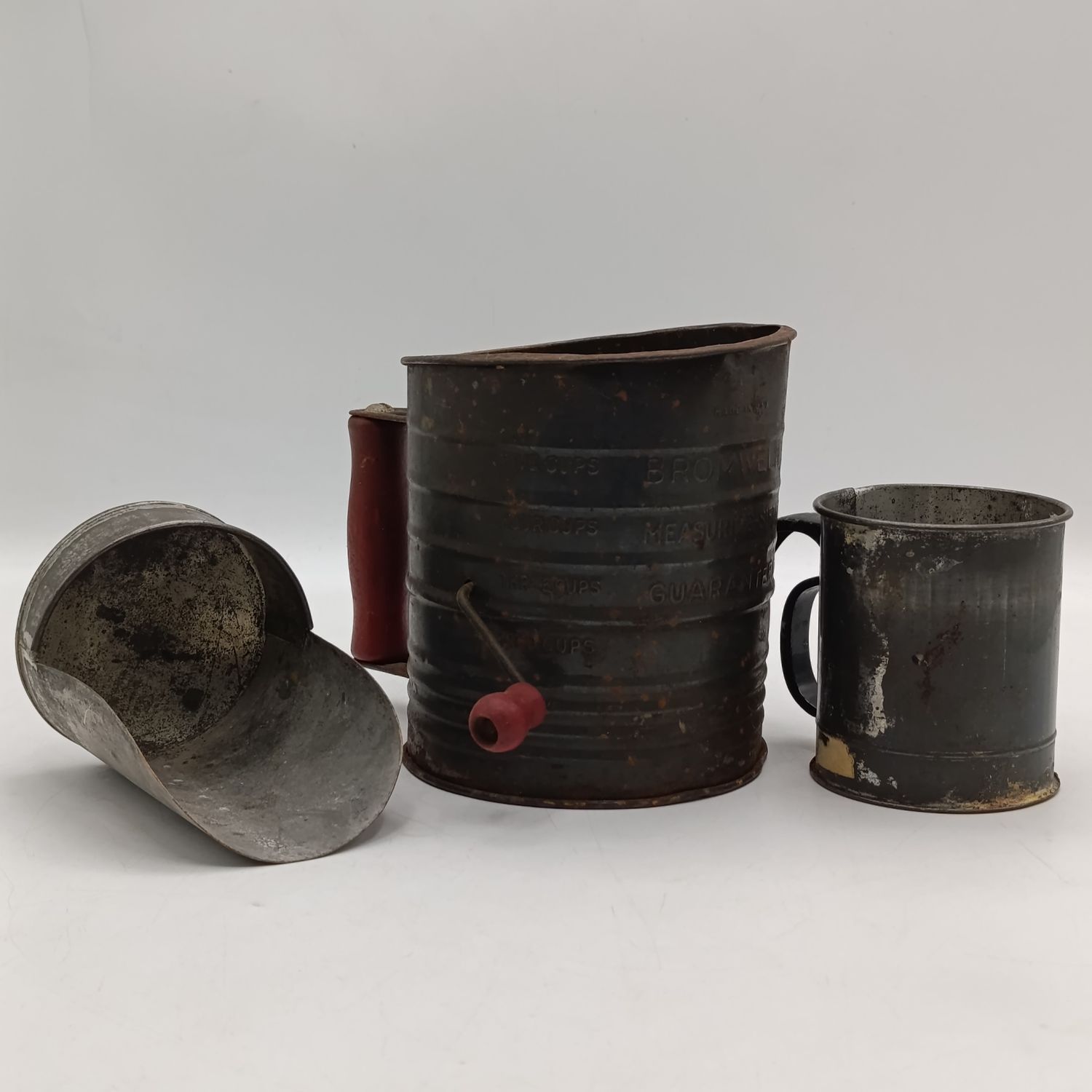 Pair of vintage flour sieves and scoop