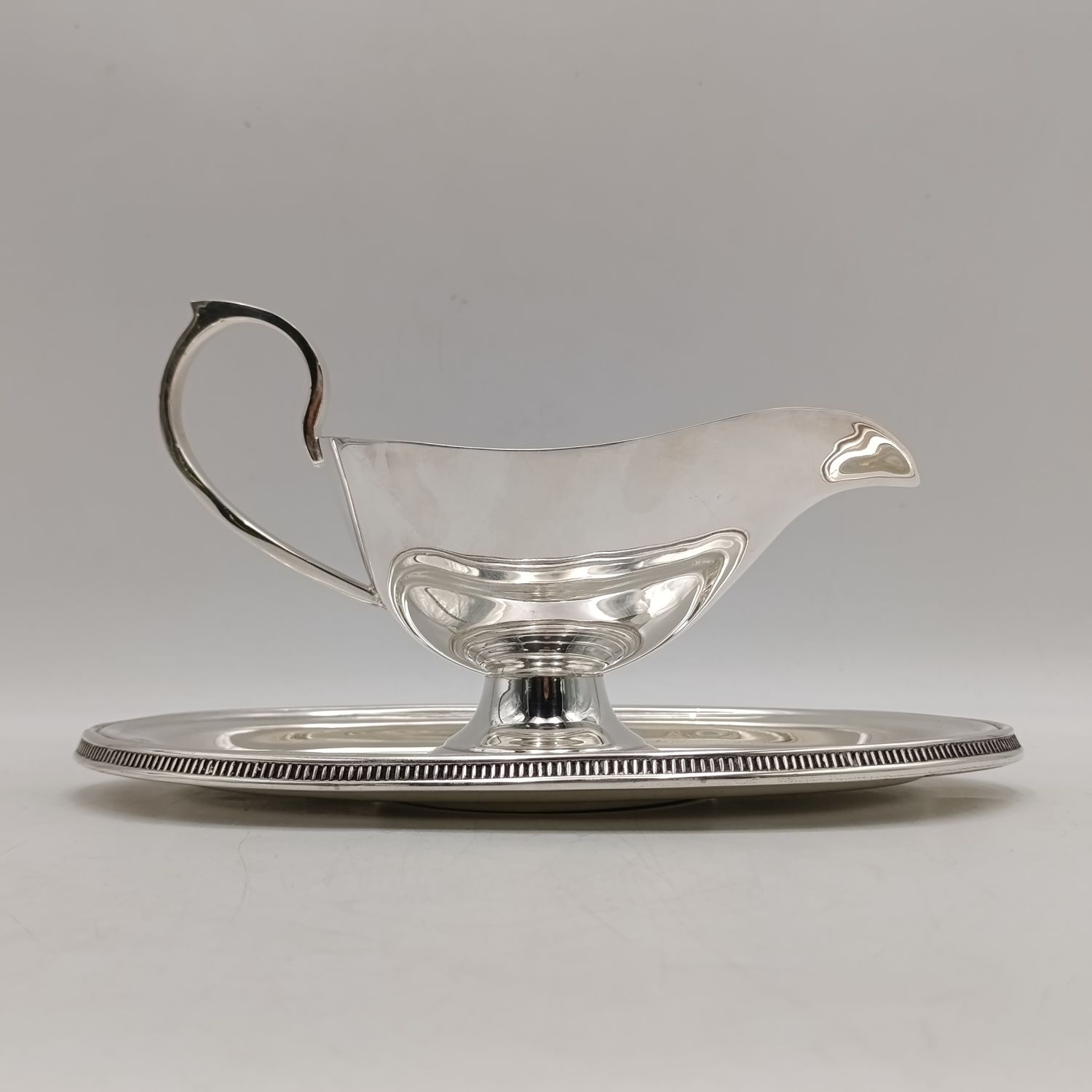 Vintage silverplated gravy boat with saucer