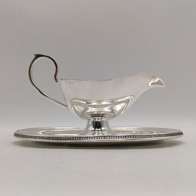 Vintage silverplated gravy boat with saucer