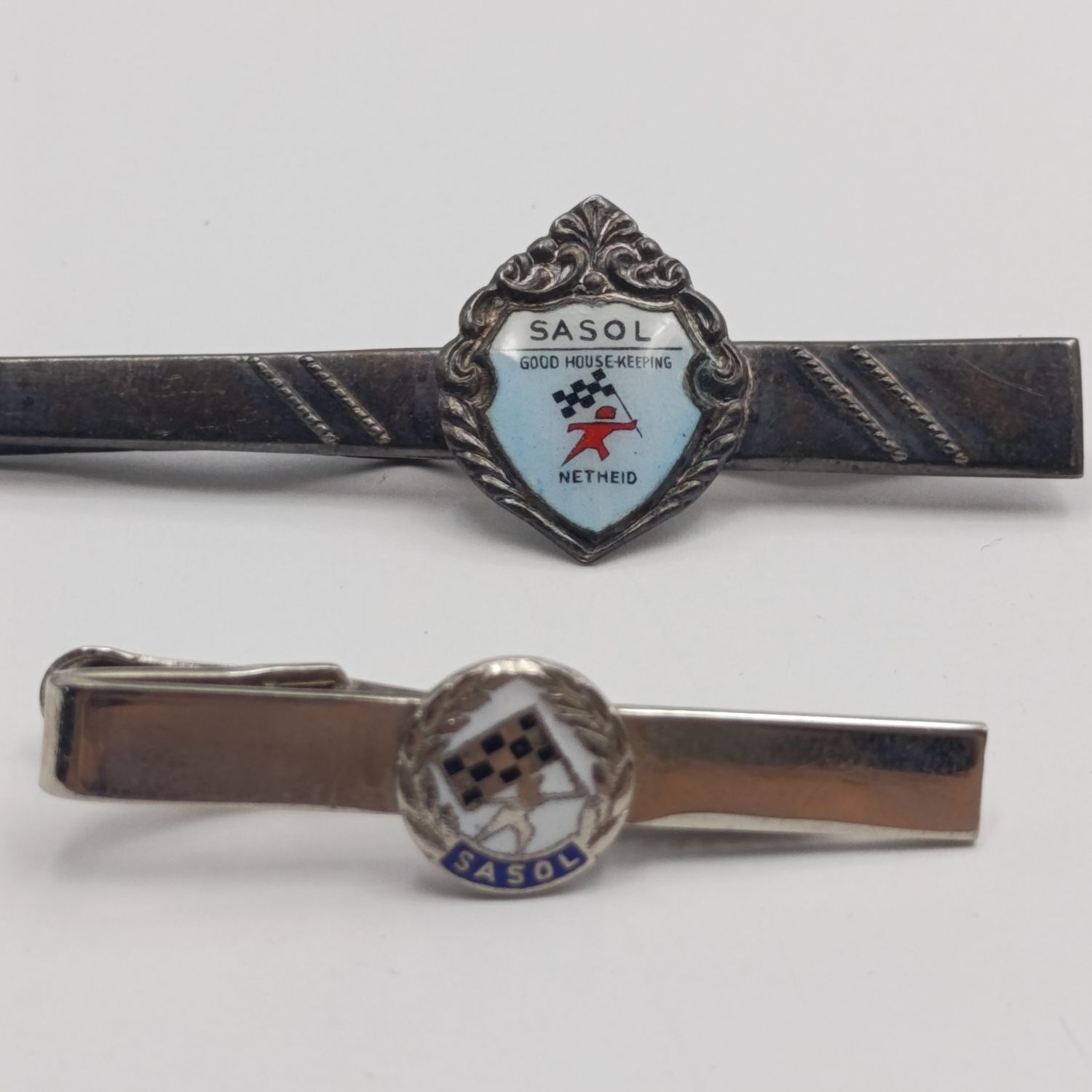 Pair of Sasol Tie pin badges - one for good housekeeping