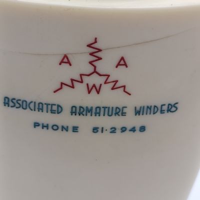 Vintage Prince table lighter with Associated Armature winders advertising