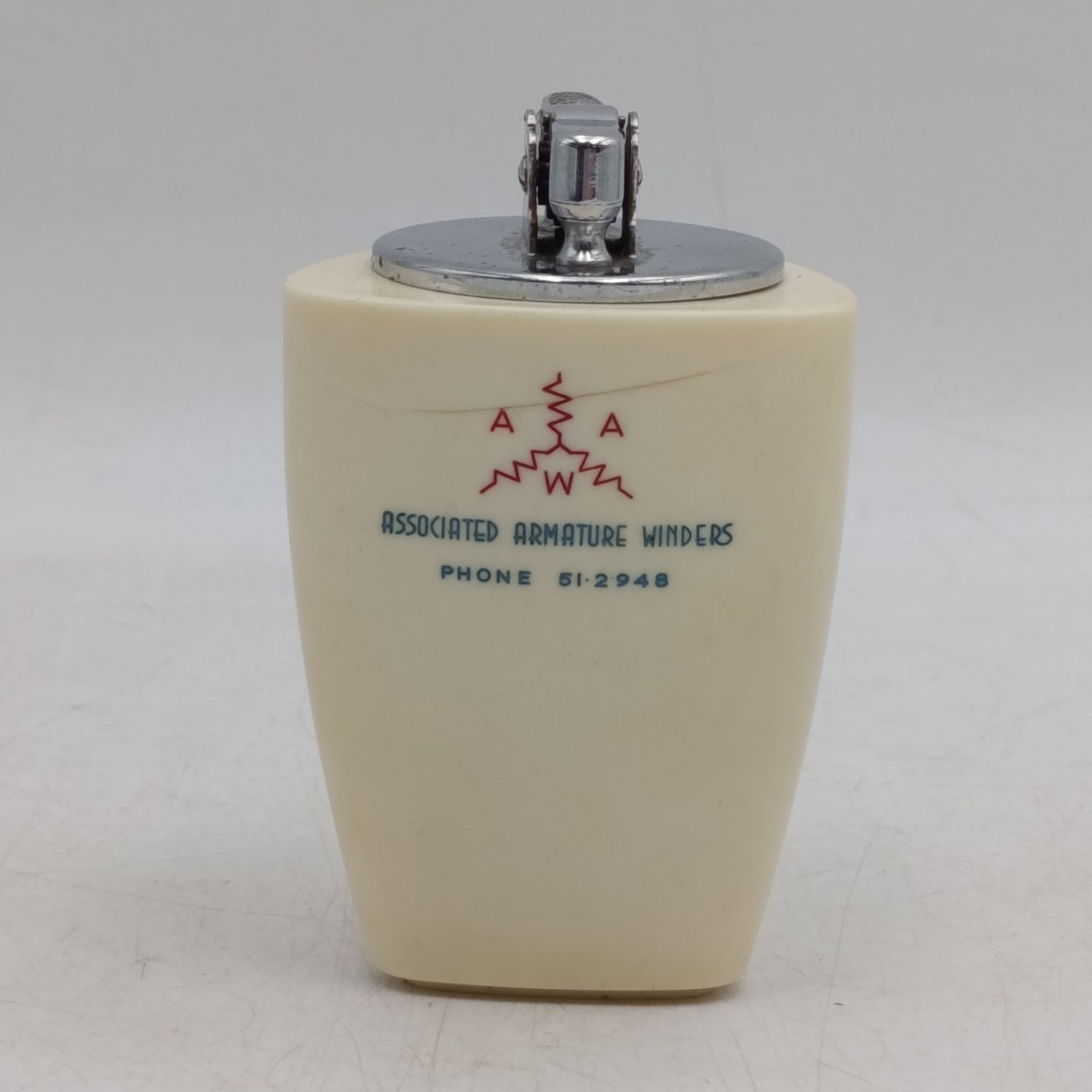 Vintage Prince table lighter with Associated Armature winders advertising