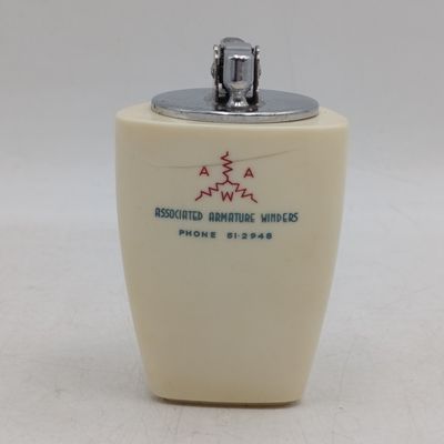 Vintage Prince table lighter with Associated Armature winders advertising