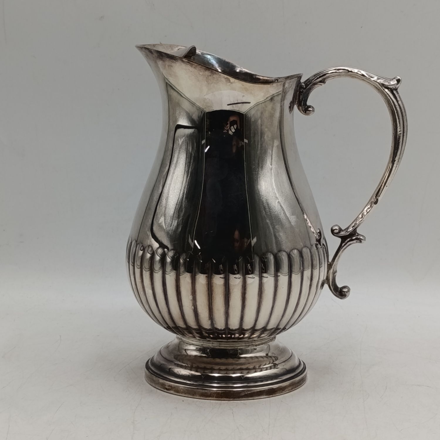 Vintage silverplated water pitcher with ice moustache
