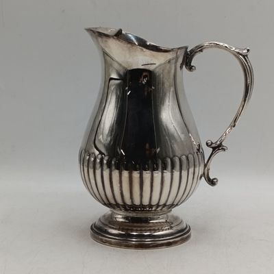 Vintage silverplated water pitcher with ice moustache