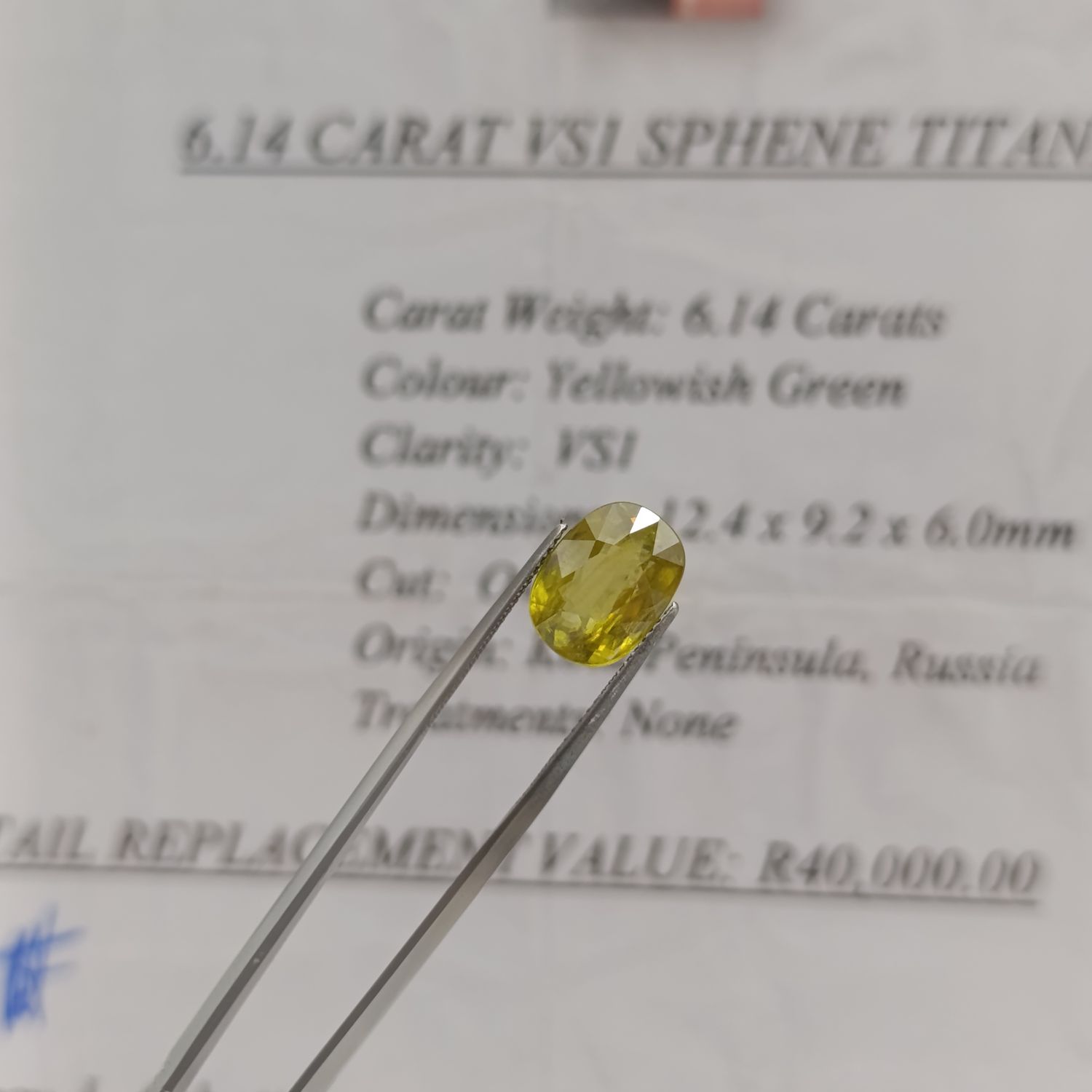 Oval Sphene Titante of 6.14ct - Yellowish Green with certificate