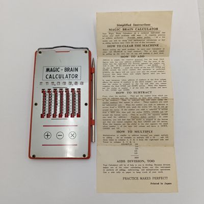 Vintage Magic Brain Calculator with pen stick ( clips broken )