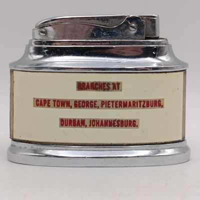 Vintage table lighter with British United shoe Machinery advertising - working