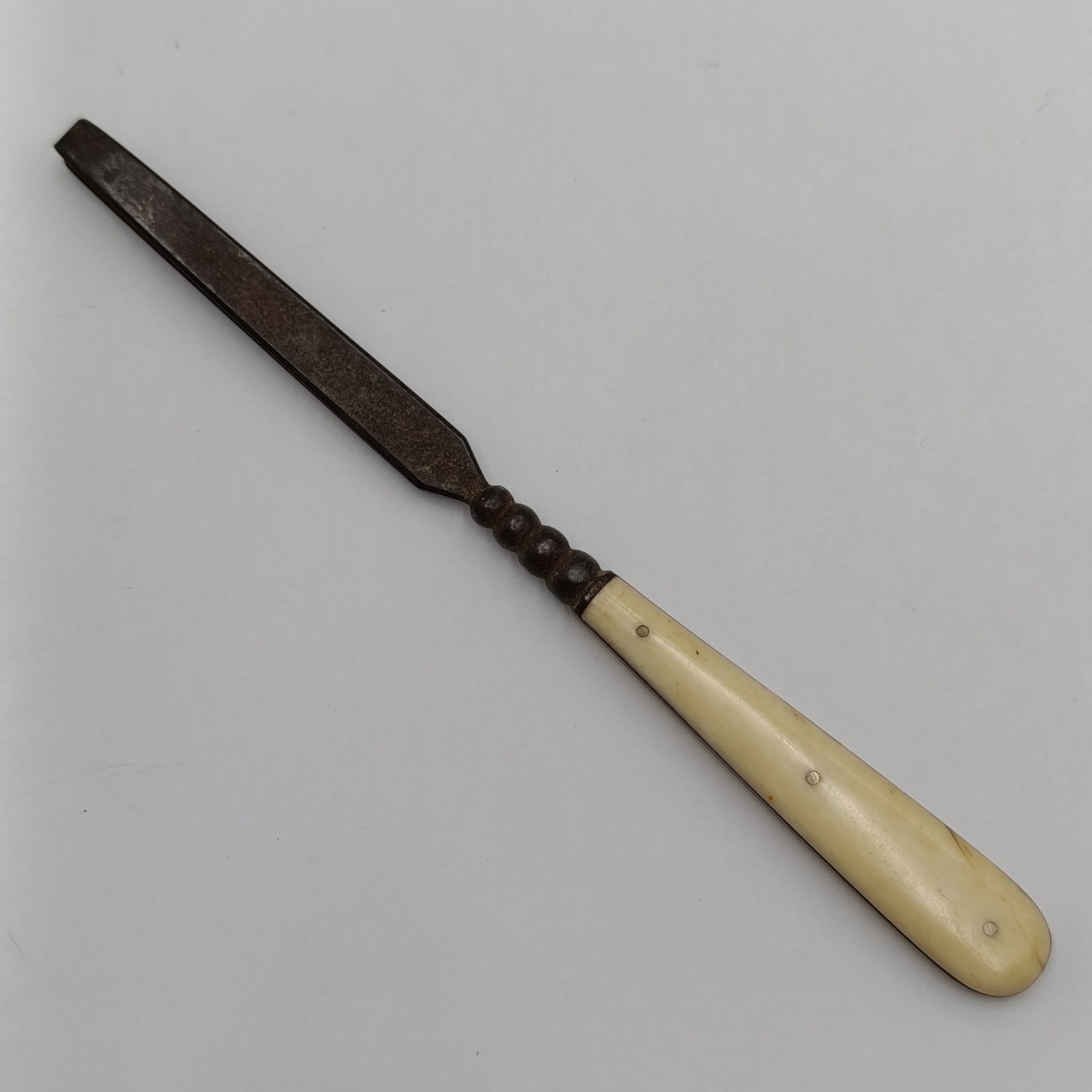 Pair of large tweezers circa 19th century with ivorene / bone handles