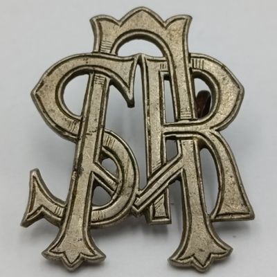 South African Railways white metal cap badge