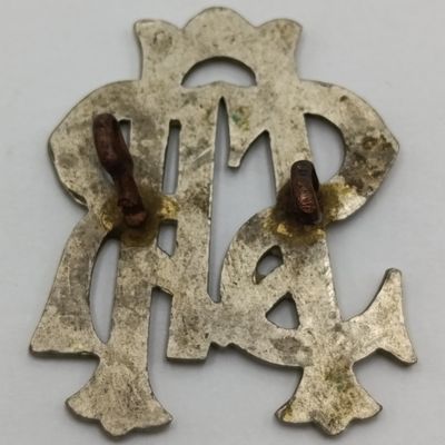 South African Railways white metal cap badge