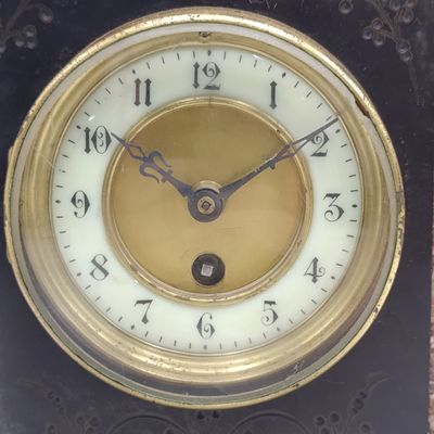Antique black slate and marble mantel clock - runs and stops