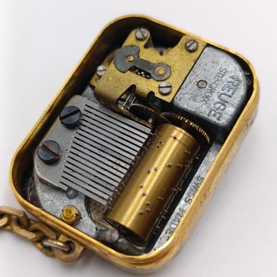 Vintage Swiss Reuge mechanical music box keychain - working