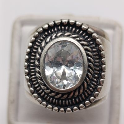 Sterling silver ring with clear stone - weight over 10g - size M