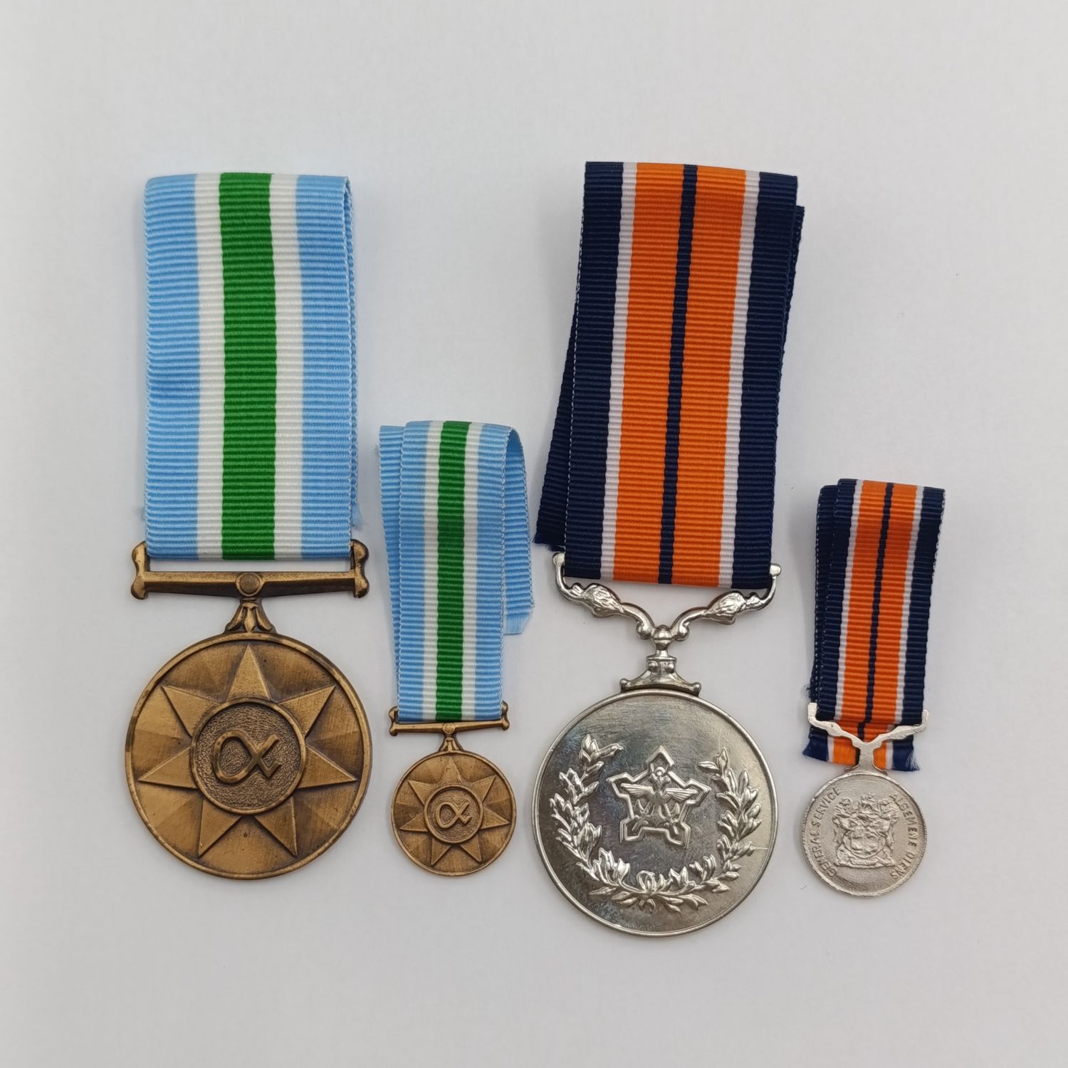 SADF general service and Unity medal set with miniatures of Sktr A Burger, in boxes