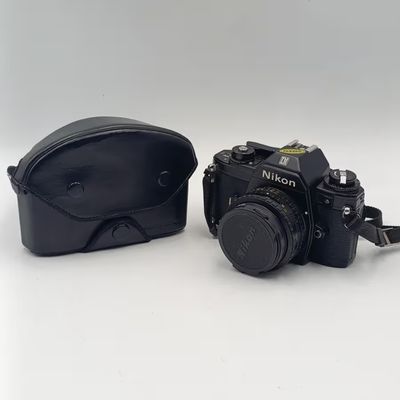 Vintage Nikon M90 35mm film camera with Nikon Series E 1:1.8 50mm lens - shutter firing