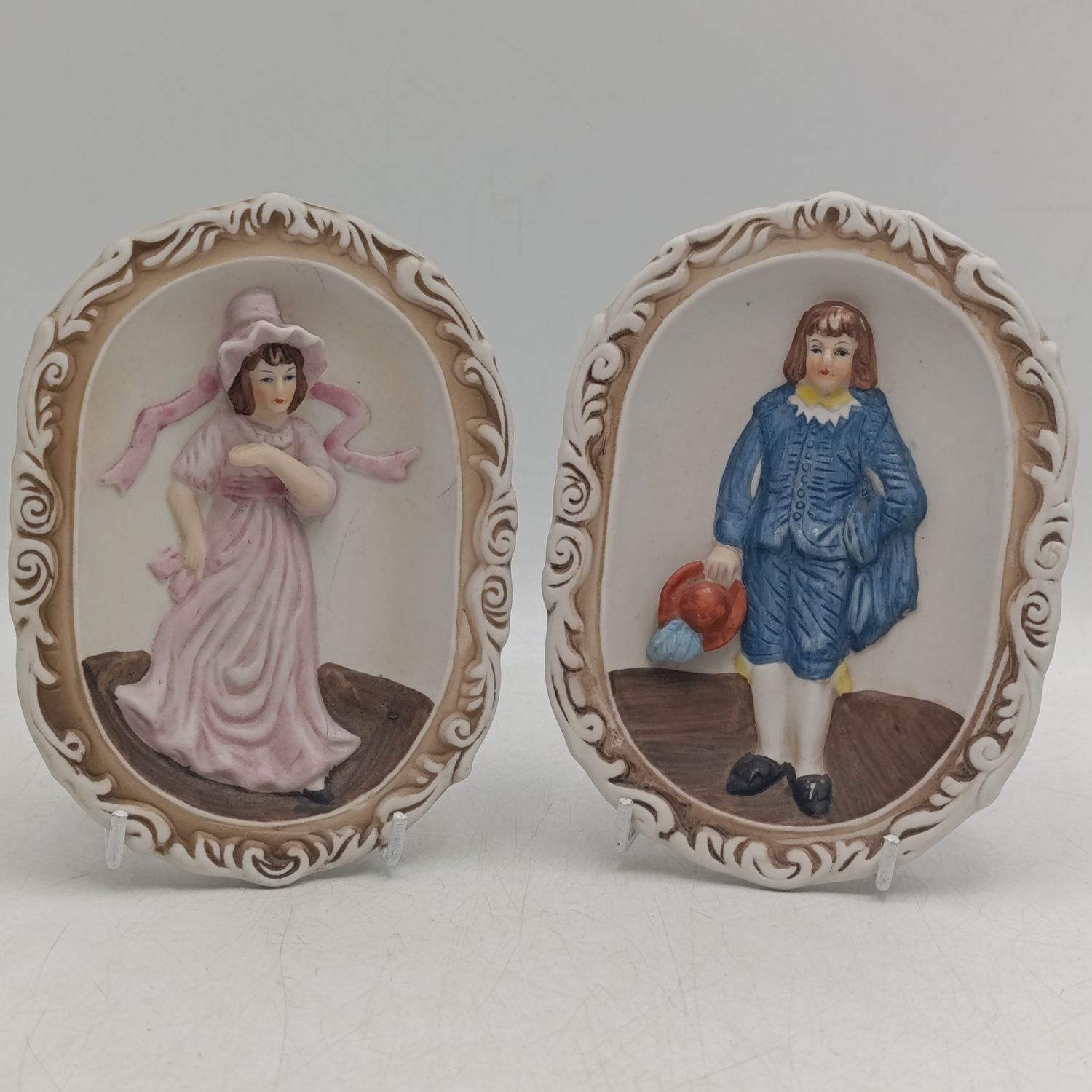 Pair of Antique Bisque wall plaques - handpainted - Little Blue Boy and Pinkie