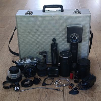 Vintage Canon AL-1 35mm camera with 1:1.8 lens, Tamron 1:2.8 28mm lens, Tamron 135mm lens, Metz 45CT-1 flash (not tested) and many other accessories in carry case - Camera Shutter is working. Vintage Canon AL-1 35mm camera with 1:1.8 lens, Tamron 1:2.8 28mm lens, Tamron 135mm lens, Metz 45CT-1 flash (not tested) and many other accessories in carry case - Camera Shutter is working.