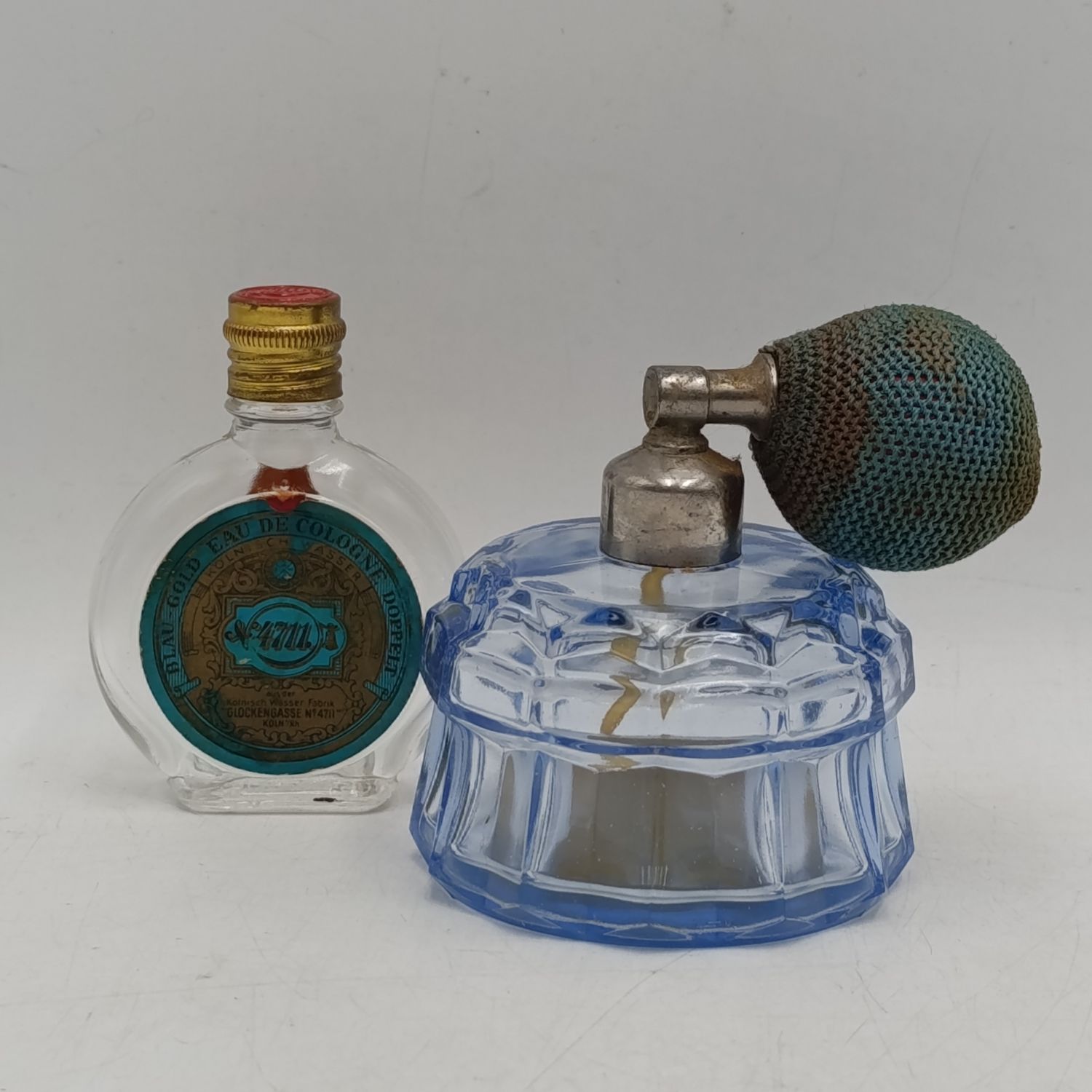 Lot of 2 vintage glass perfume bottles - one with labels